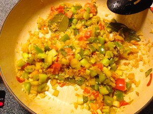 The 'Holy Trinity,' vegetables, and rice just before the chicken broth is added.